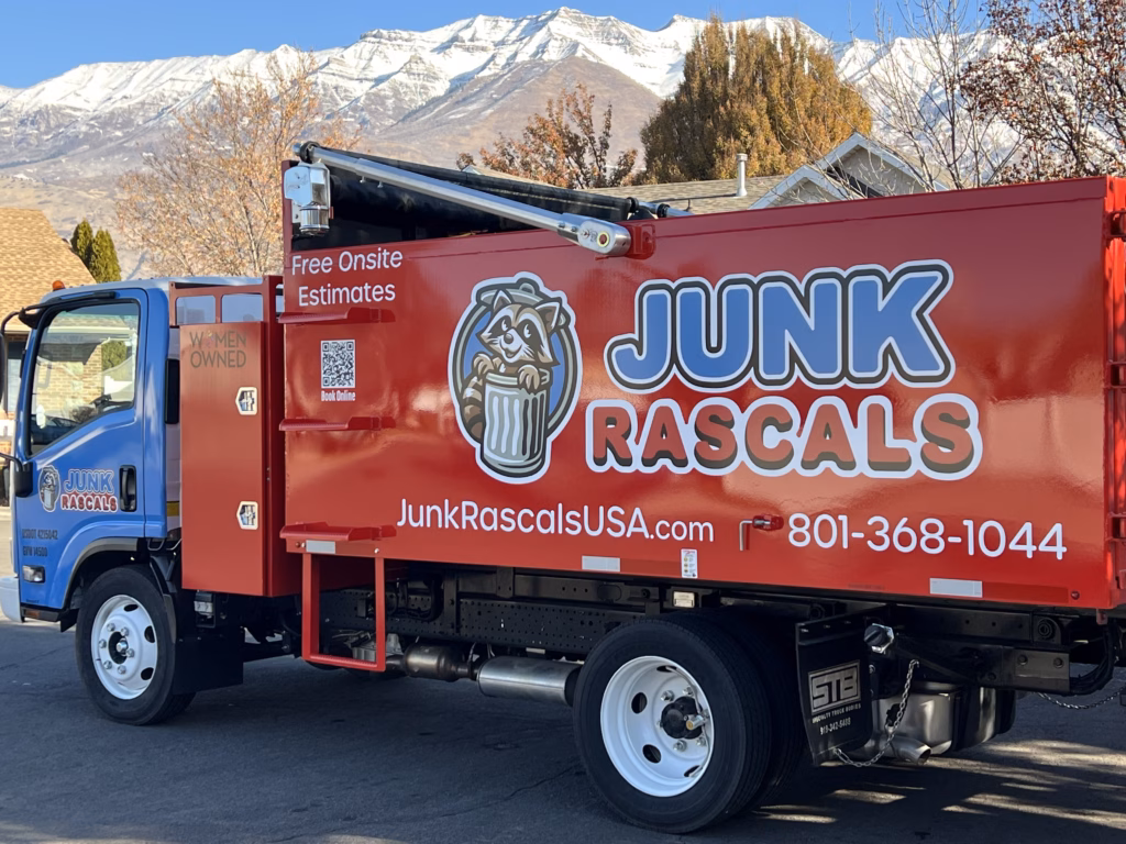 Junk Rascals dump truck in front of a snowy background